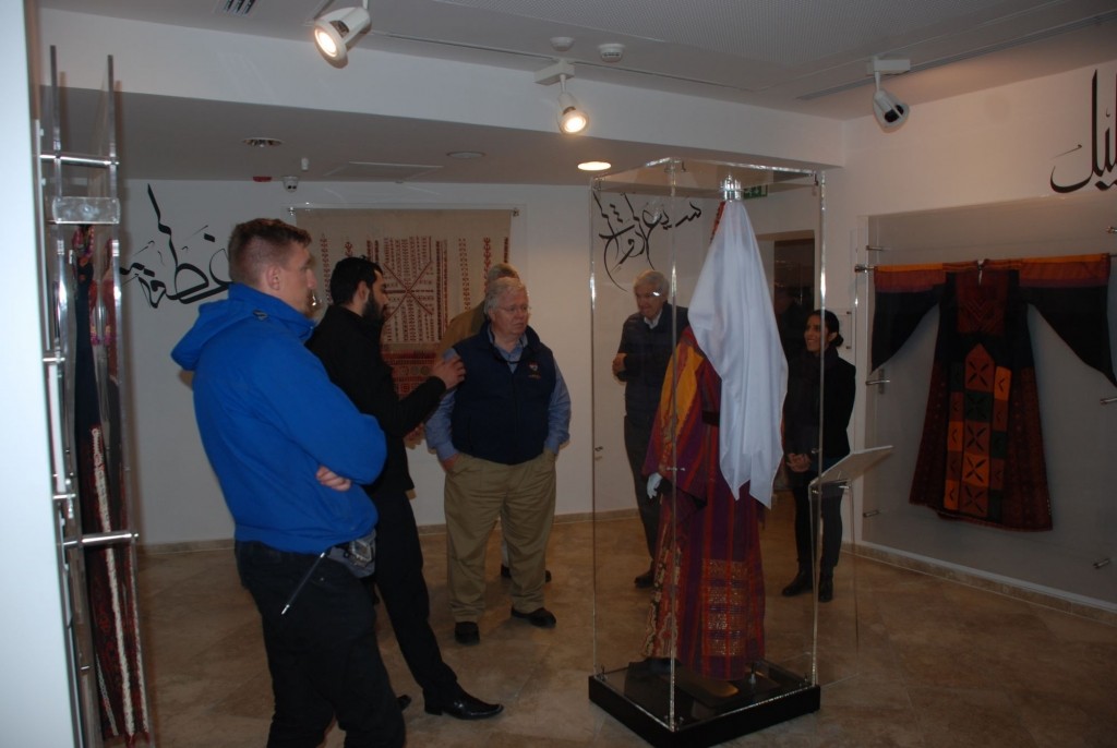 UNICEF Delegation listening to the story of the traditional wedding dress of Bethlehem, the head dress “Al-Shatweh” worn by married women, and the chest piece indicating the dresser’s religion – January 20th, 2016